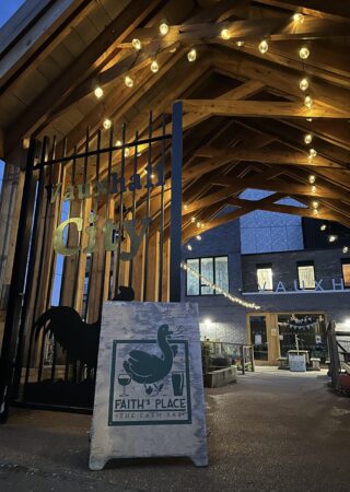 Entrance to Faith's Place bar with festoon lighting and sign